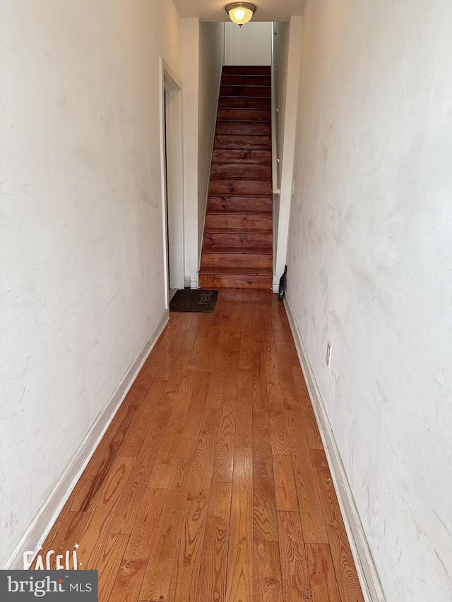 1511 W Seybert St, Philadelphia, PA 19121 - hallway with wood finished floors, baseboards, and stairway