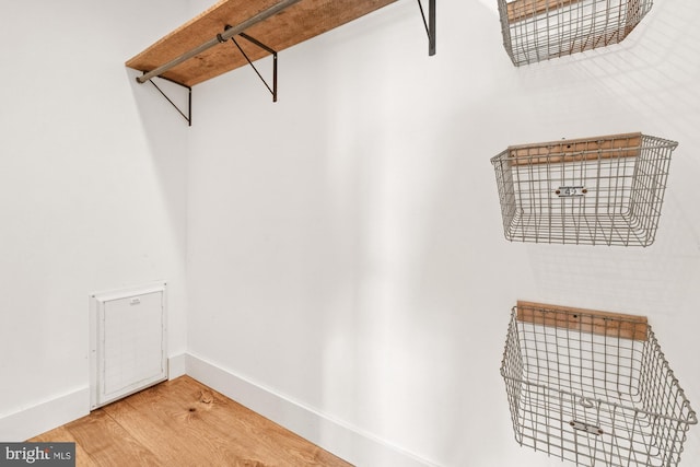 spacious closet with wood finished floors