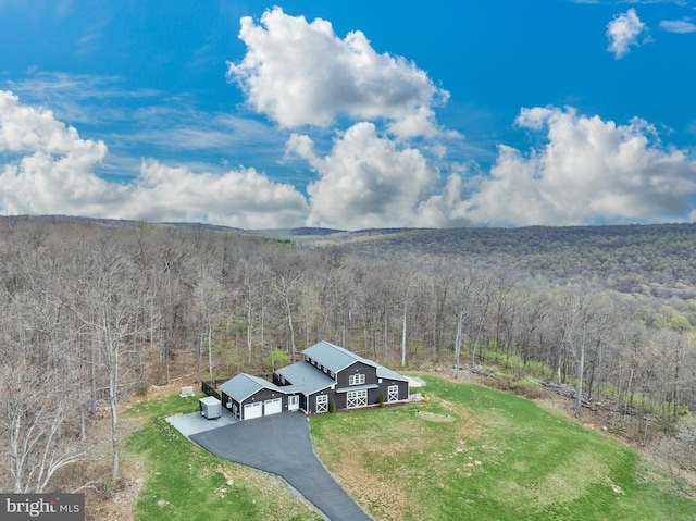 aerial view featuring a view of trees