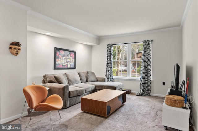 carpeted living area with baseboards and crown molding