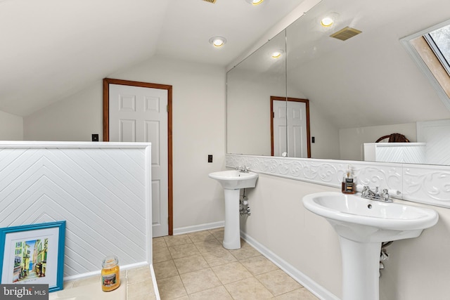 bathroom with recessed lighting, lofted ceiling, visible vents, and tile patterned floors