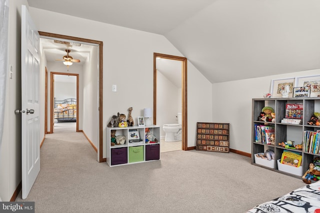 playroom featuring vaulted ceiling, carpet flooring, and baseboards