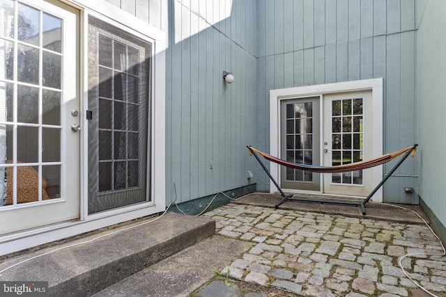 view of exterior entry featuring french doors