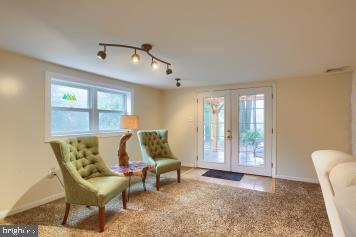 20 Tower Rd, Dillsburg, PA 17019 - sitting room with french doors, carpet flooring, and rail lighting