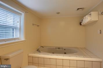 20 Tower Rd, Dillsburg, PA 17019 - bathroom featuring a whirlpool tub and toilet