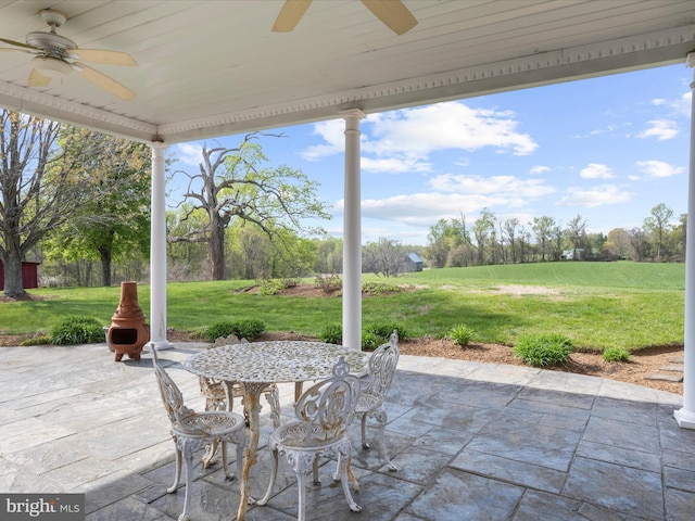view of patio with ceiling fan and outdoor dining space