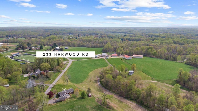 bird's eye view featuring a forest view