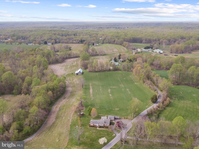 drone / aerial view with a forest view and a rural view