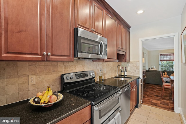 3275 Sutton Pl NW Unit A, Washington, DC 20016 - kitchen featuring stainless steel appliances, a sink, dark stone counters, backsplash, and beverage cooler