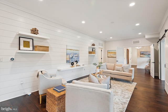 141 W St Unit 304, Annapolis, MD 21401 - living room featuring a barn door, recessed lighting, dark wood-style floors, baseboards, and wooden walls
