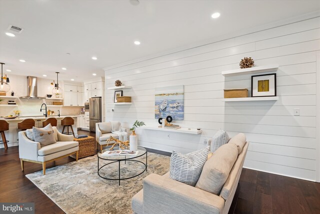 141 W St Unit 304, Annapolis, MD 21401 - living room with dark wood-type flooring, recessed lighting, and wooden walls