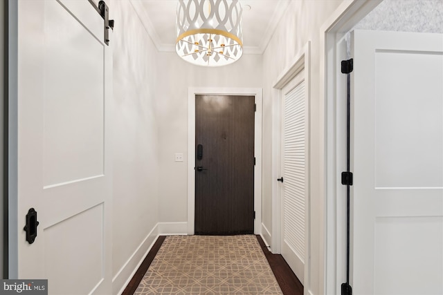141 W St Unit 304, Annapolis, MD 21401 - entrance foyer featuring ornamental molding, a chandelier, baseboards, and dark wood-type flooring