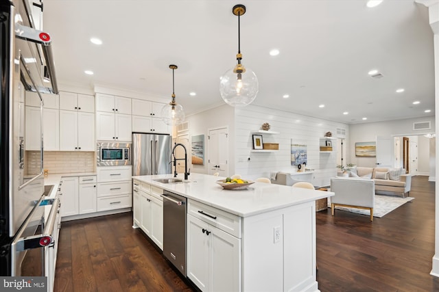 141 W St Unit 304, Annapolis, MD 21401 - kitchen with a sink, appliances with stainless steel finishes, white cabinets, backsplash, and dark wood-type flooring