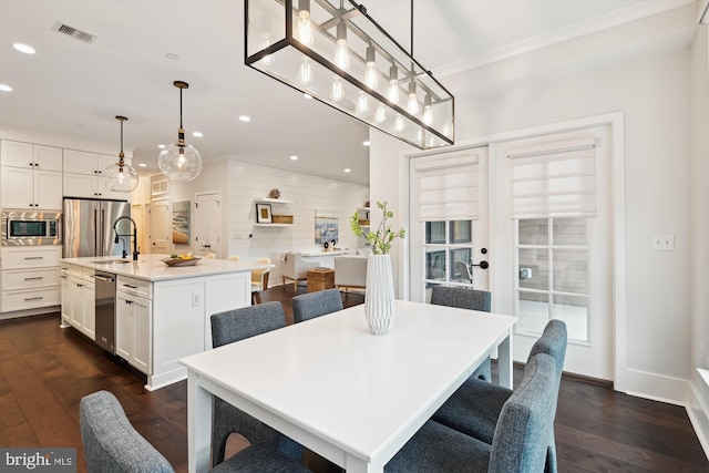 141 W St Unit 304, Annapolis, MD 21401 - dining area with dark wood finished floors, recessed lighting, baseboards, and ornamental molding