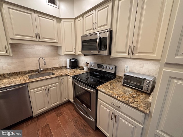1805 S Crystal Dr S Unit 1109S, Arlington, VA 22202 - kitchen featuring appliances with stainless steel finishes, a sink, dark wood-type flooring, and tasteful backsplash