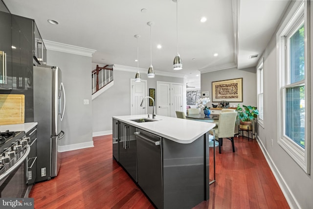 kitchen featuring a sink, crown molding, stainless steel appliances, and dark wood-style flooring