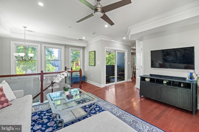 living area featuring crown molding, wood finished floors, baseboards, recessed lighting, and ceiling fan with notable chandelier