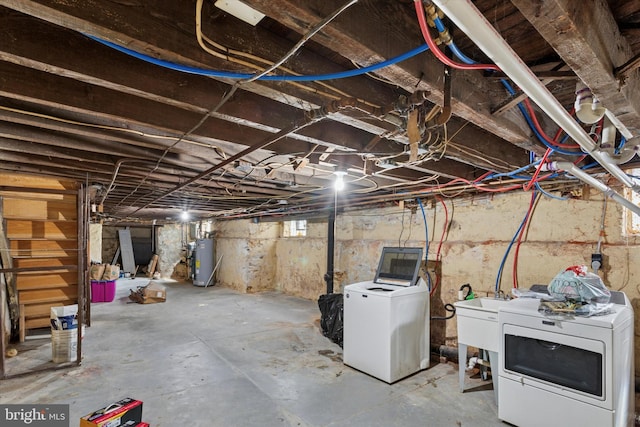 7038 Tulip St, Philadelphia, PA 19135 - unfinished basement with washer and dryer, a sink, and gas water heater