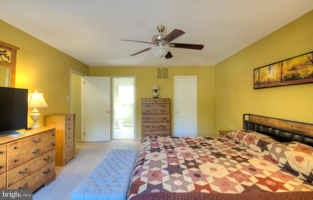 bedroom with visible vents, a ceiling fan, and light colored carpet