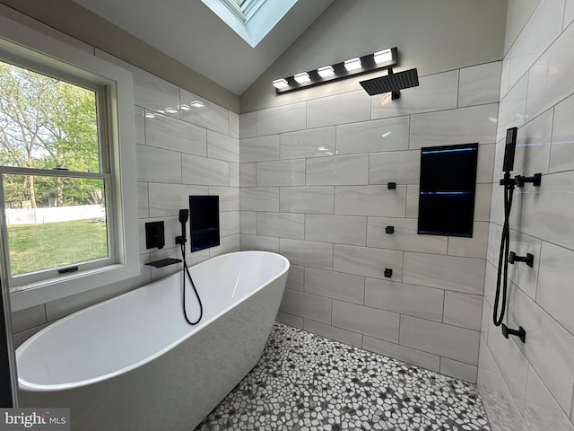 849 Glenn Cir, Wayne, PA 19087 - full bath featuring a freestanding tub, a skylight, vaulted ceiling, and a tile shower