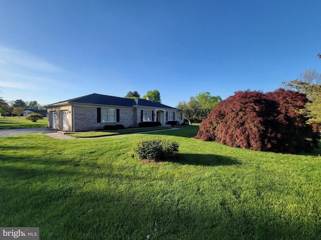 7198 Allegheny Dr, Frederick, MD 21702 - single story home with brick siding, driveway, a front yard, and a garage