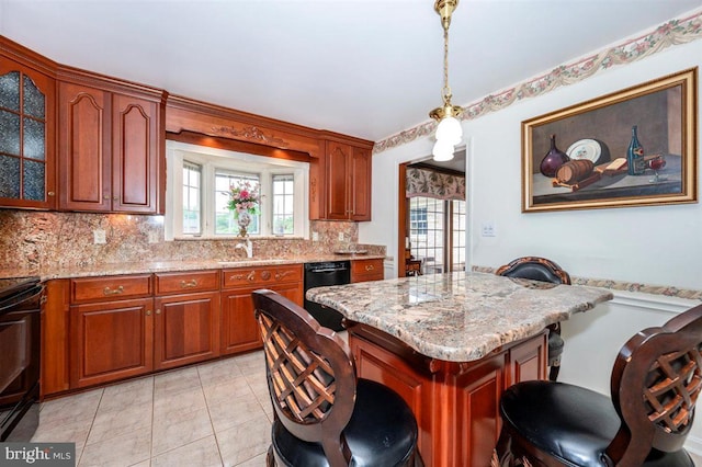 7198 Allegheny Dr, Frederick, MD 21702 - kitchen with decorative backsplash, glass insert cabinets, a kitchen breakfast bar, a sink, and black appliances