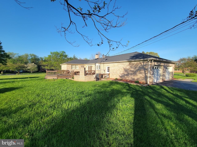 7198 Allegheny Dr, Frederick, MD 21702 - back of house with a lawn, a chimney, a wooden deck, and brick siding