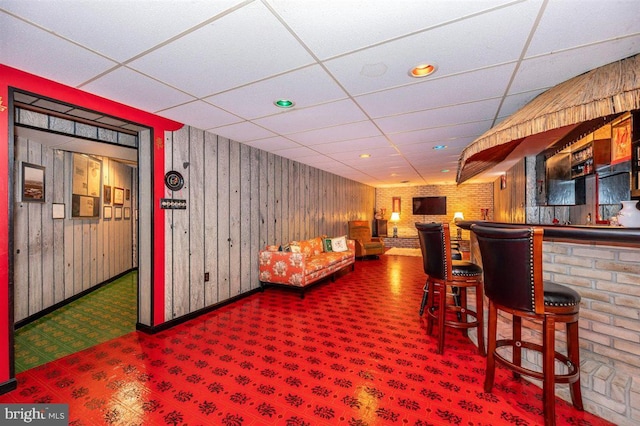 7198 Allegheny Dr, Frederick, MD 21702 - bar with a dry bar, wood walls, baseboards, a drop ceiling, and carpet flooring