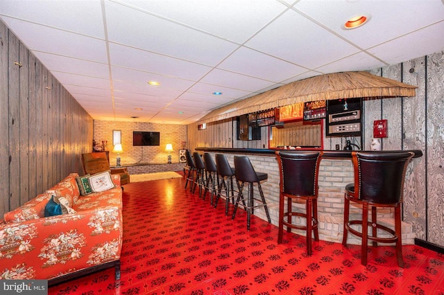 7198 Allegheny Dr, Frederick, MD 21702 - bar with a bar, wood walls, carpet, and a paneled ceiling