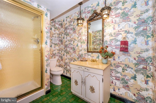7198 Allegheny Dr, Frederick, MD 21702 - bathroom featuring toilet, wallpapered walls, a shower stall, and vanity