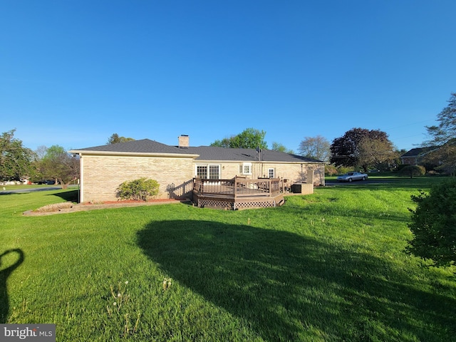7198 Allegheny Dr, Frederick, MD 21702 - back of property featuring a chimney, a lawn, and a deck
