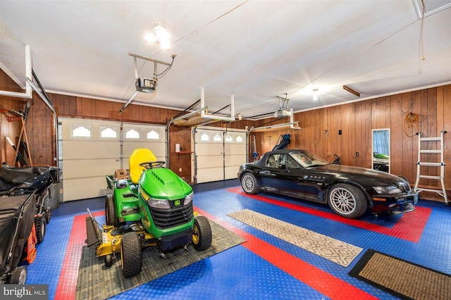 7198 Allegheny Dr, Frederick, MD 21702 - garage featuring wood walls and a garage door opener