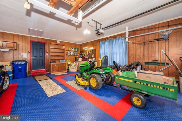 7198 Allegheny Dr, Frederick, MD 21702 - garage featuring a garage door opener and wooden walls