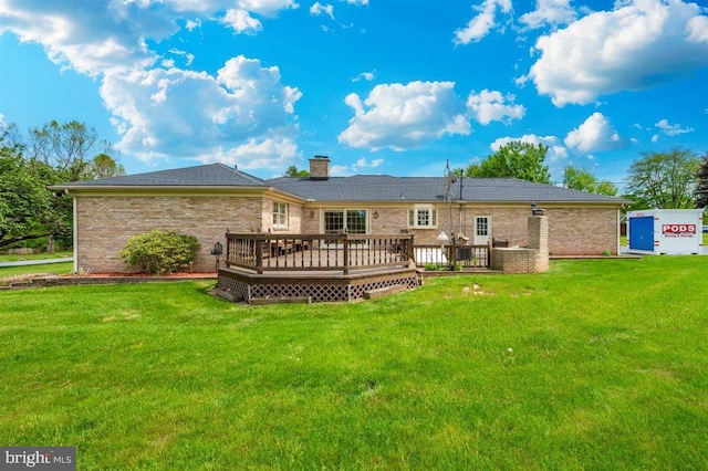 7198 Allegheny Dr, Frederick, MD 21702 - back of house with a lawn, a chimney, brick siding, and a deck