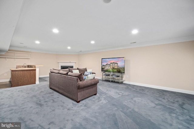 living room featuring baseboards, dark carpet, recessed lighting, and ornamental molding