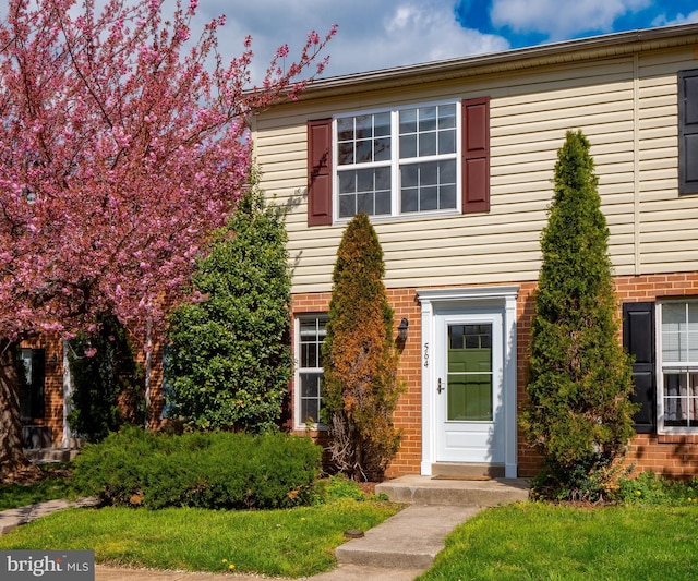 view of front of home featuring brick siding
