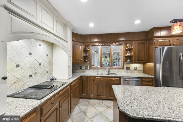 kitchen with a sink, tasteful backsplash, appliances with stainless steel finishes, open shelves, and light tile patterned floors