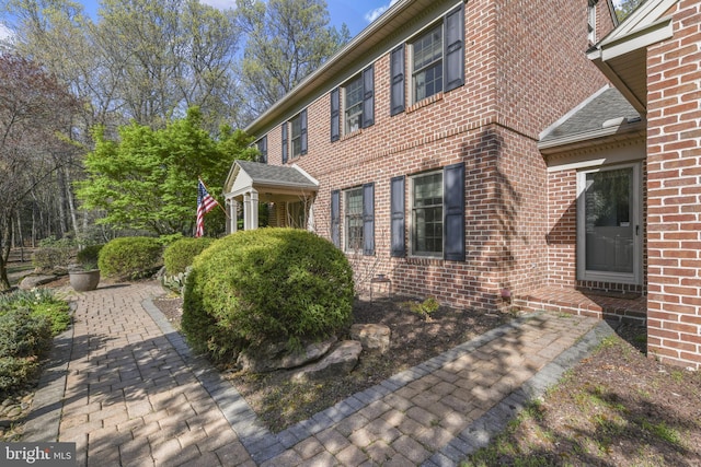 view of home's exterior featuring brick siding