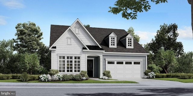 view of front of property featuring concrete driveway and an attached garage