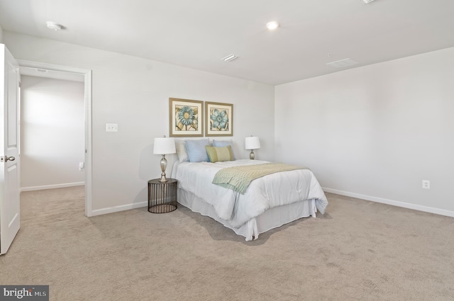 carpeted bedroom featuring baseboards