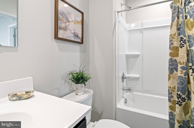full bathroom featuring shower / bath combination with curtain, vanity, and toilet