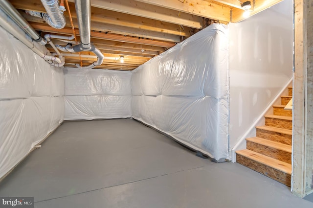 unfinished basement with stairs