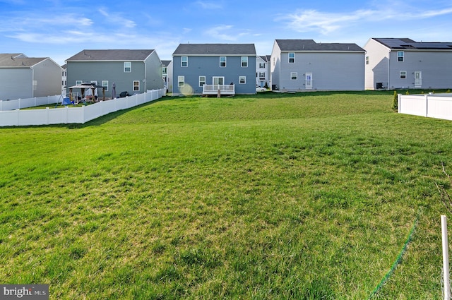 view of yard featuring a residential view and fence