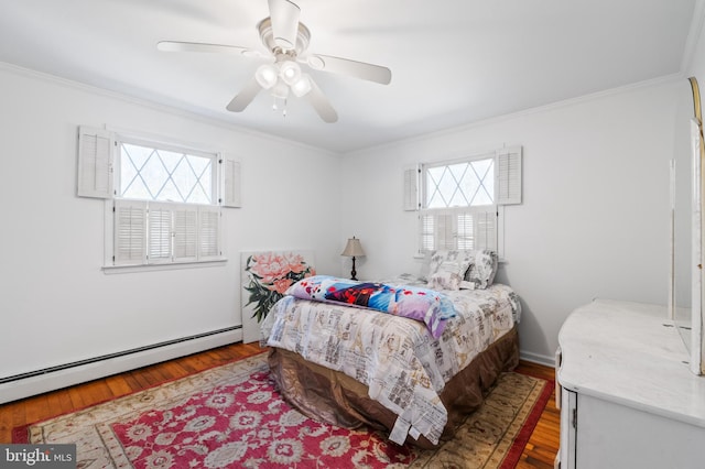 bedroom featuring a baseboard radiator, wood finished floors, ceiling fan, and ornamental molding
