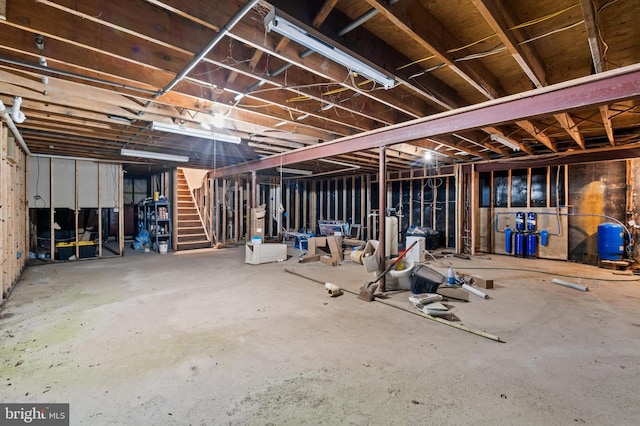 unfinished basement with stairway