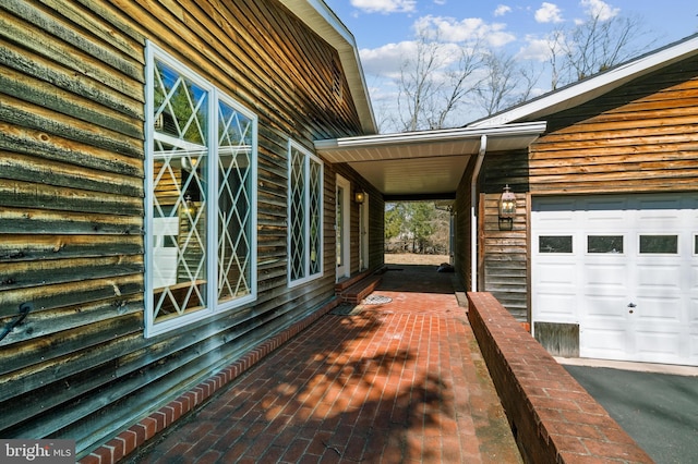 view of side of property with a garage