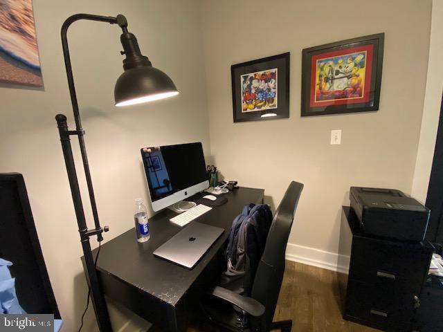 office with wood finished floors and baseboards