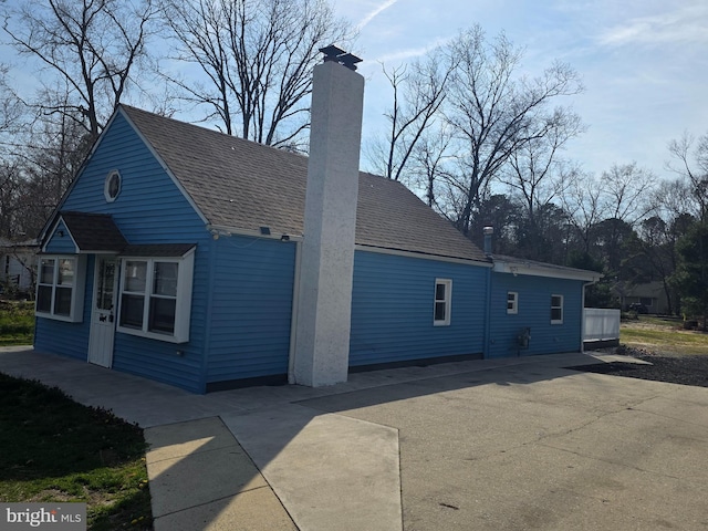 exterior space featuring a chimney