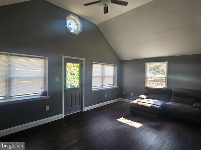 entryway featuring ceiling fan, vaulted ceiling, wood finished floors, and a healthy amount of sunlight