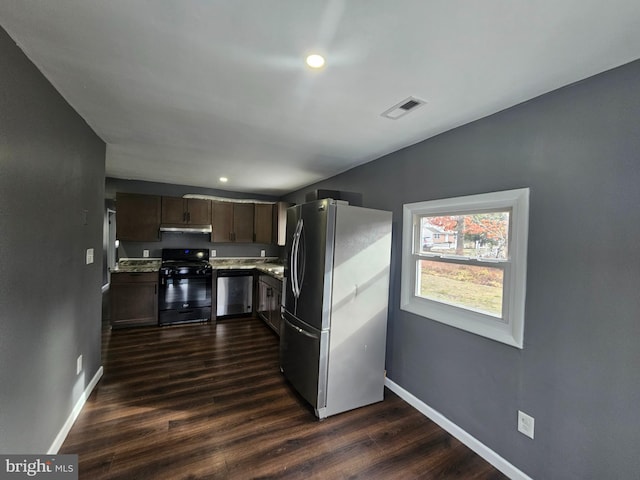 kitchen with dark brown cabinetry, baseboards, visible vents, dark wood finished floors, and appliances with stainless steel finishes